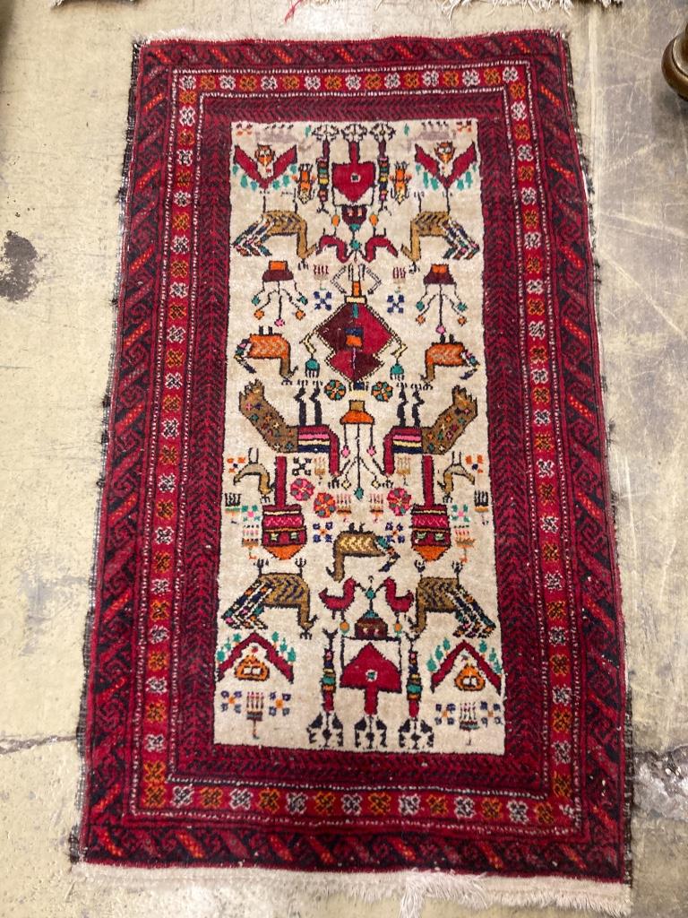 Two Bokhara rugs and a Turkish mat, largest 130 x 76cm